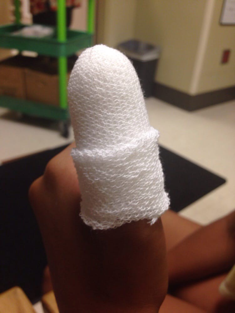 A finger wrapped in a white bandage, indicating an injury.