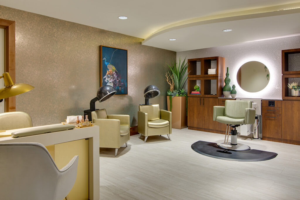 A modern salon with comfortable seating and stylish decor.