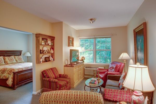 A cozy living room with comfortable seating and a large window.