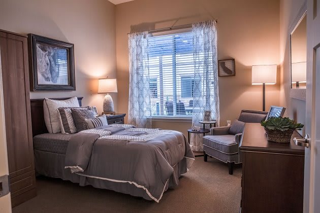 A cozy bedroom with soft lighting and tasteful decor.