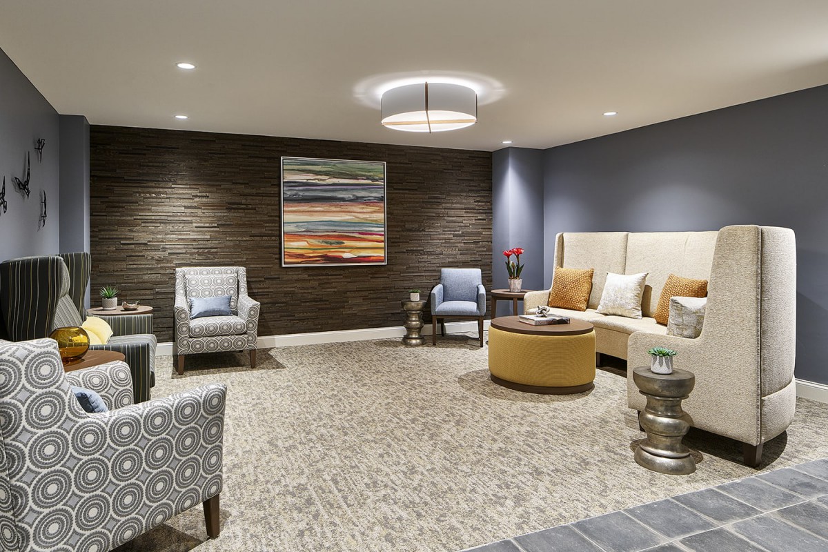 A modern lobby with comfortable seating and contemporary artwork.