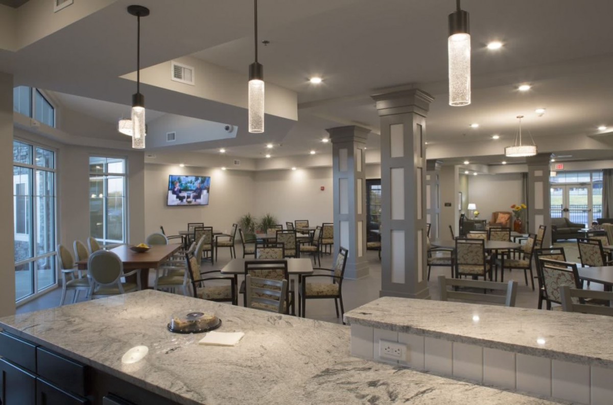 A modern dining area with stylish lighting and comfortable seating arrangements.