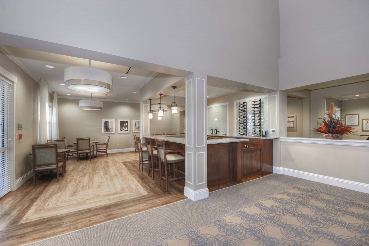 A modern open-concept kitchen and dining area with wooden accents.