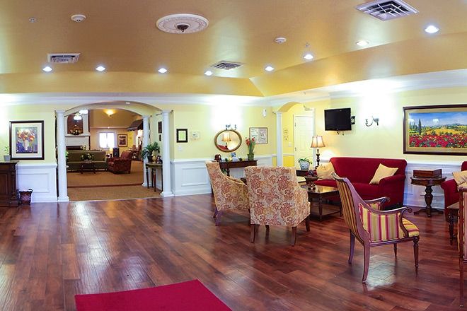 A cozy and well-lit lobby area with comfortable seating and stylish decor.