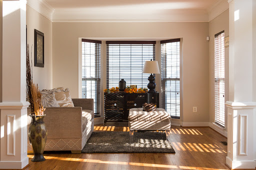 A cozy living room filled with natural light, showcasing modern furniture and elegant decor.