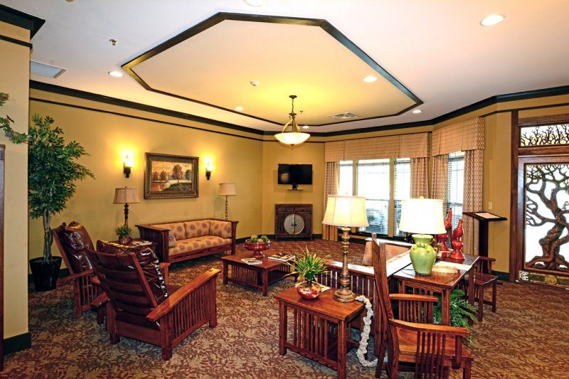 A cozy living room with warm lighting and classic furniture.