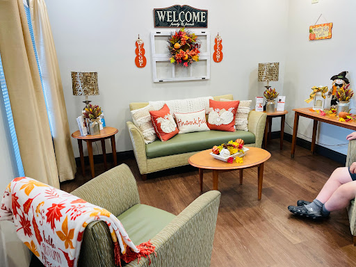 A cozy living room adorned with autumn decorations, perfect for welcoming guests.