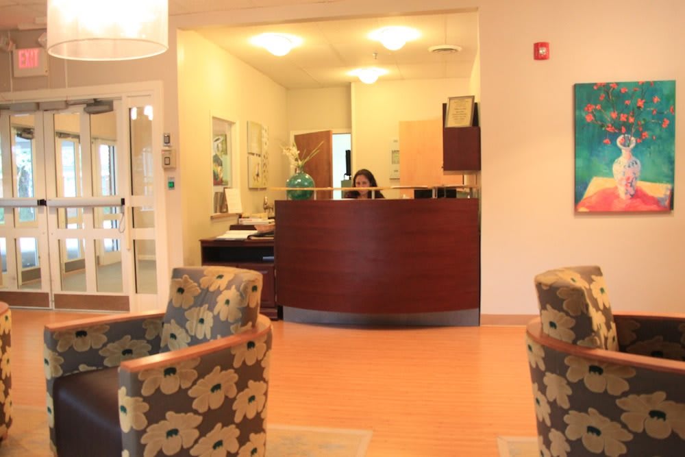 A welcoming reception area with a desk and seating for visitors.