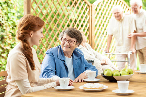 A warm afternoon gathering, where family members enjoy tea and share joyful conversations.