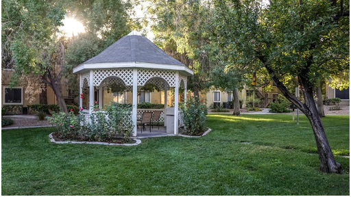 A serene gazebo nestled in a lush garden, perfect for relaxation.