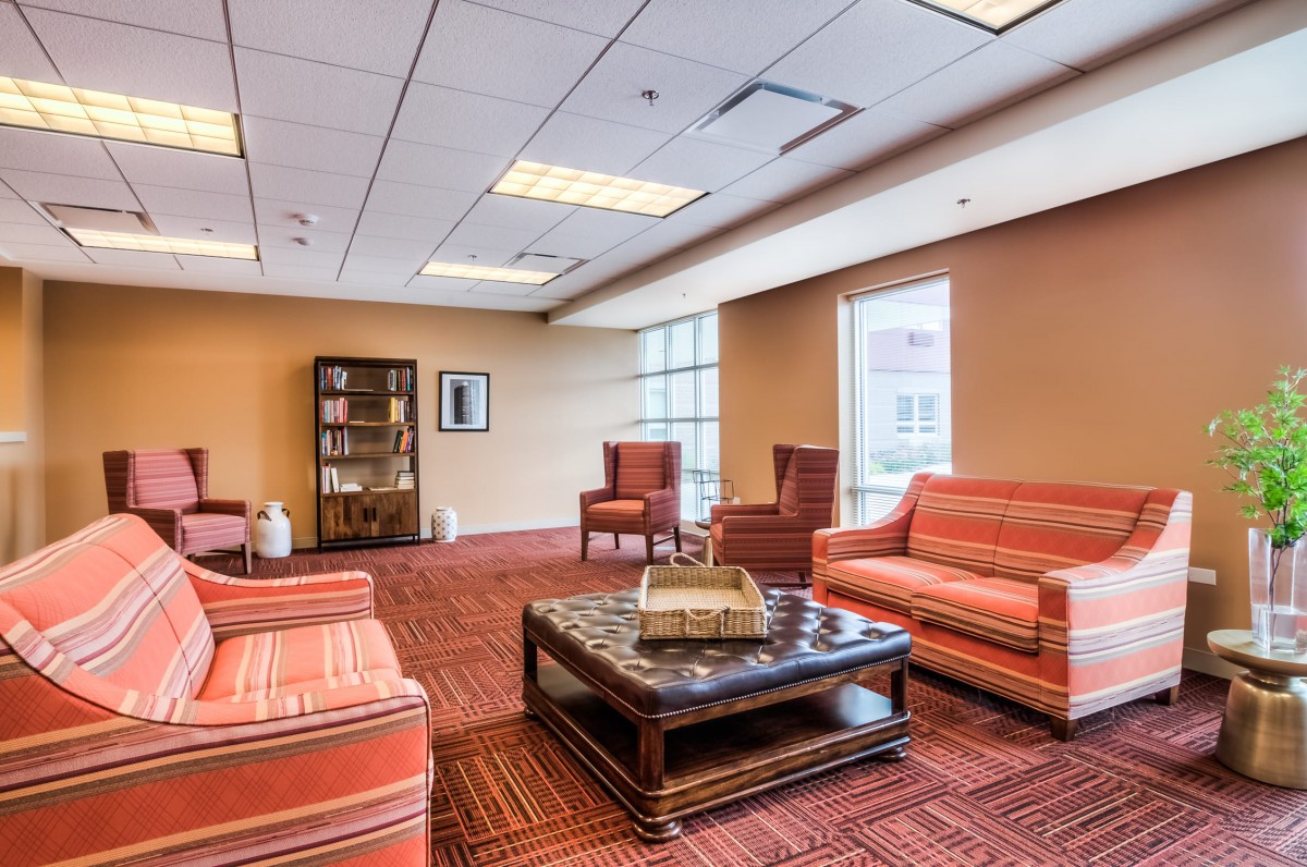 A comfortable lobby area with seating and a coffee table.