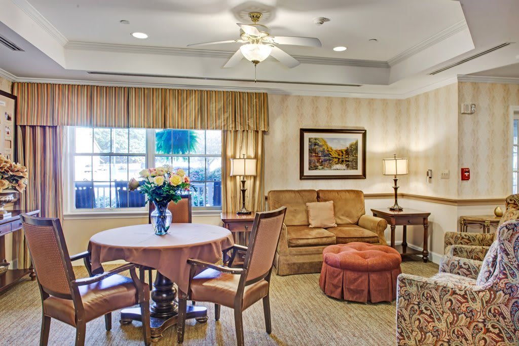 A cozy living room with elegant furniture and warm lighting.