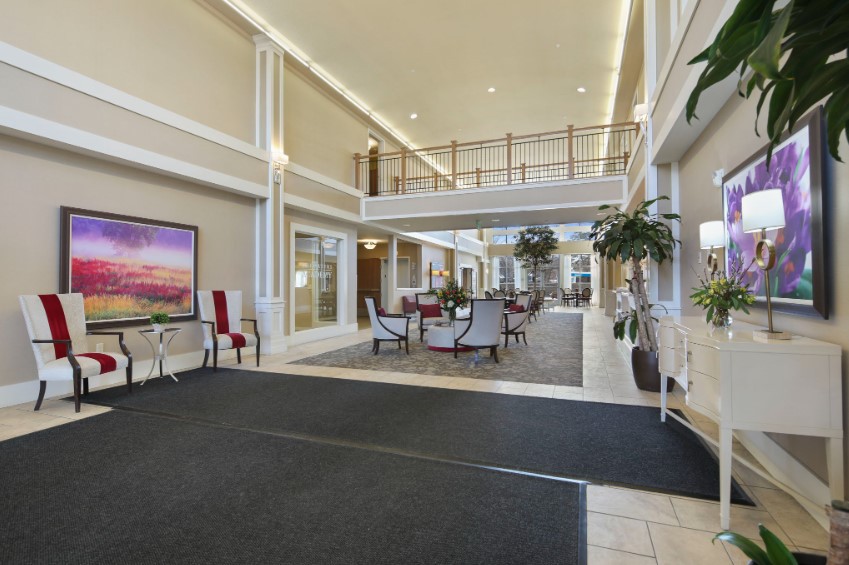 A modern and spacious lobby area with contemporary furniture and bright lighting.