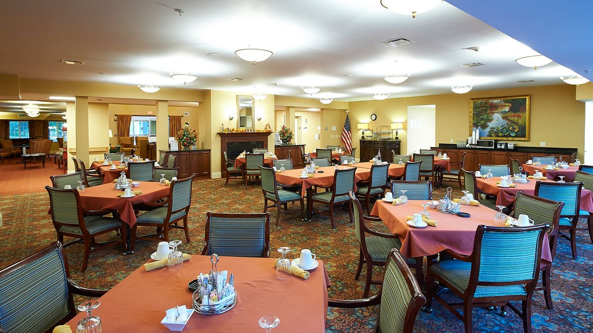 A well-decorated dining room with tables set for a meal.