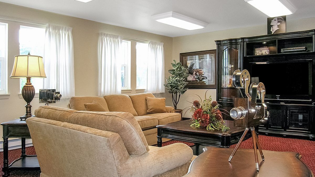 A cozy living room with comfortable seating and natural lighting.