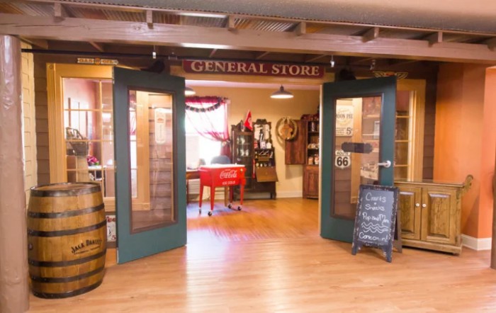 Entrance to a charming general store with rustic decor and wooden floors.
