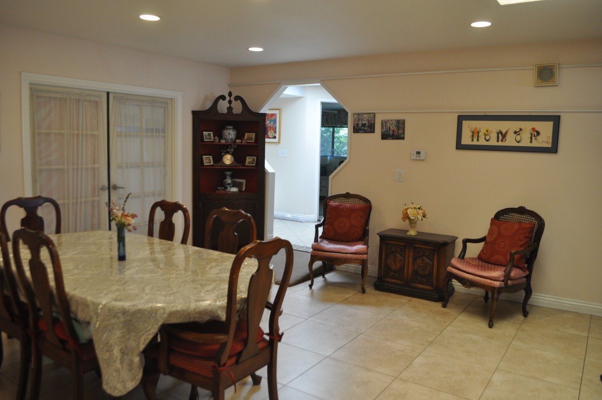 A cozy dining room with elegant furnishings and a classic decor style.