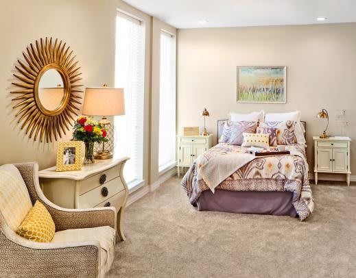 A cozy and well-decorated bedroom with modern furnishings and soft lighting.