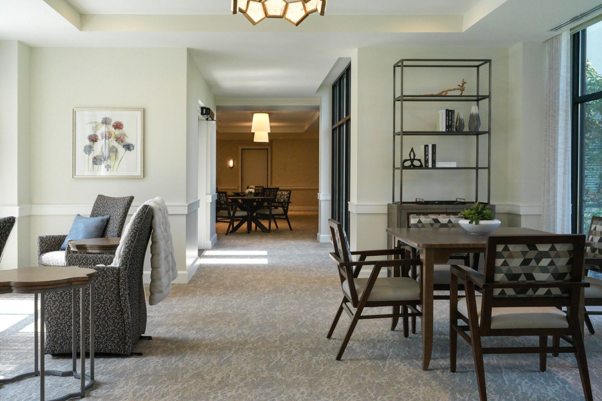 A modern dining area with contemporary furniture and elegant decor.