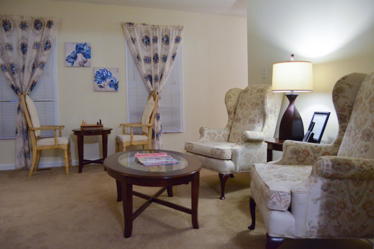 A cozy living room with elegant furniture and warm lighting.