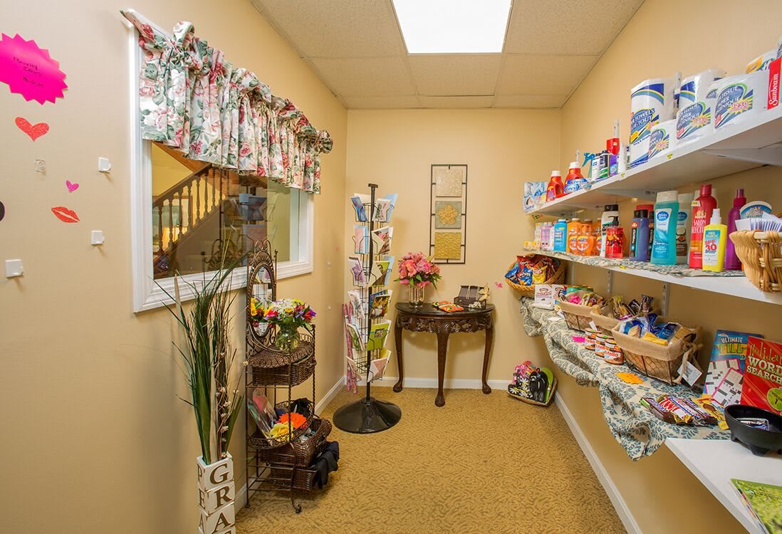 A well-organized laundry room with shelves stocked with detergent and cleaning supplies.