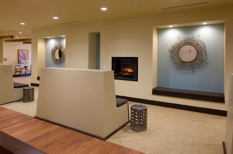 A modern interior with a cozy fireplace and minimalist decor.