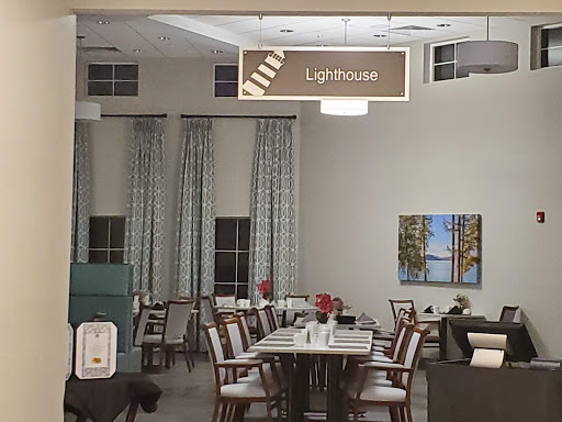 A cozy dining area featuring neatly arranged tables and elegant decor.