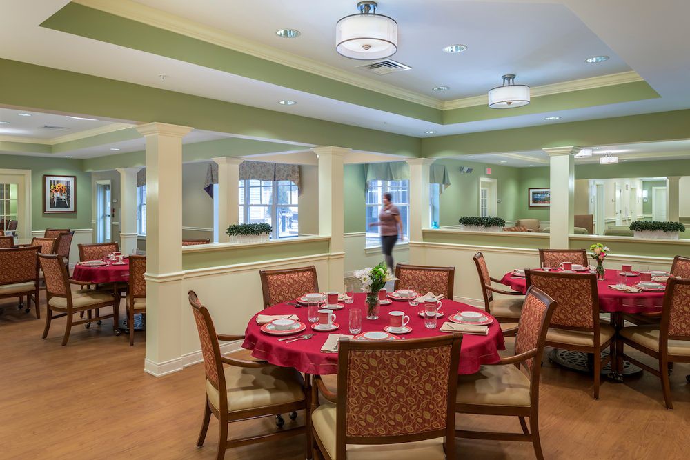 A well-decorated dining area with set tables and comfortable seating.