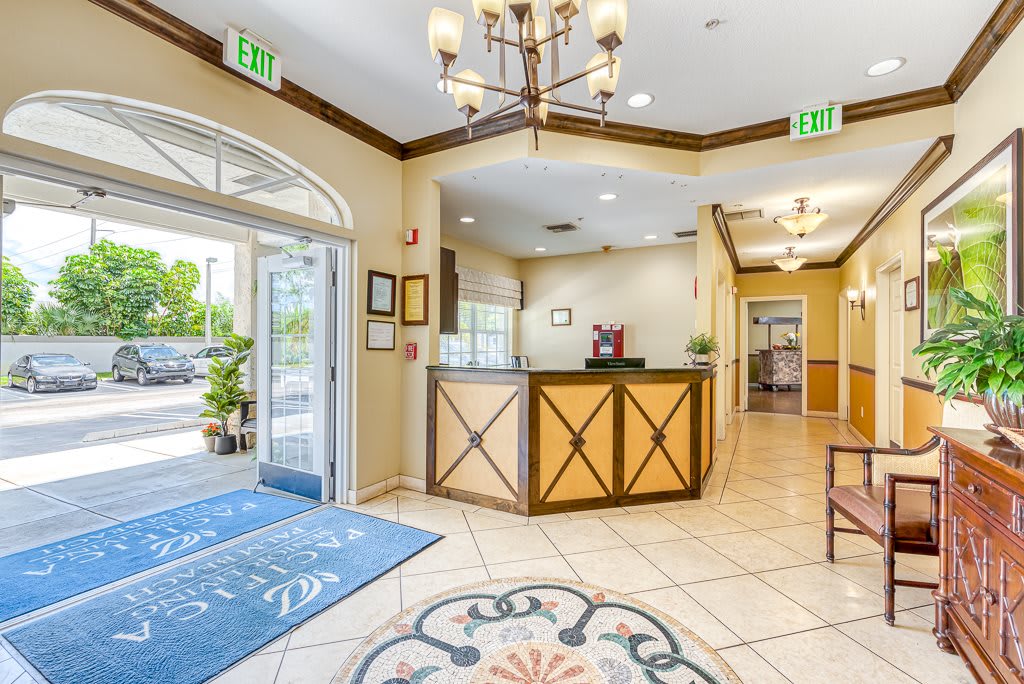 A welcoming hotel lobby with a reception desk and elegant interior design.