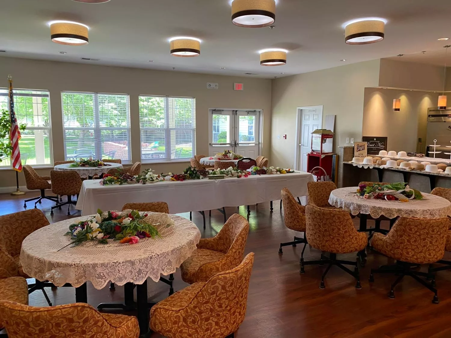 A decorated dining area prepared for a banquet event with arranged tables and chairs.