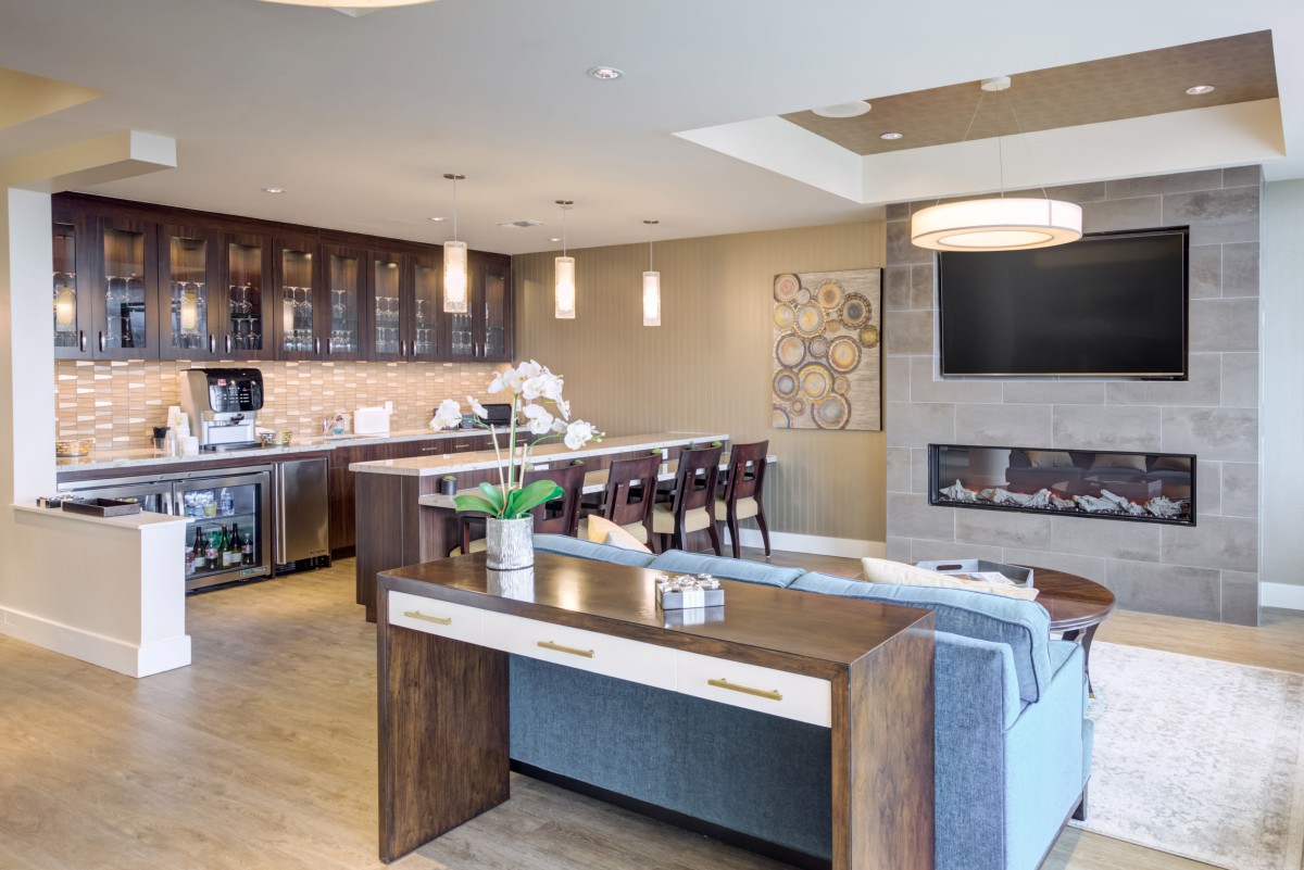 A modern open-concept kitchen and living room with elegant interior design.