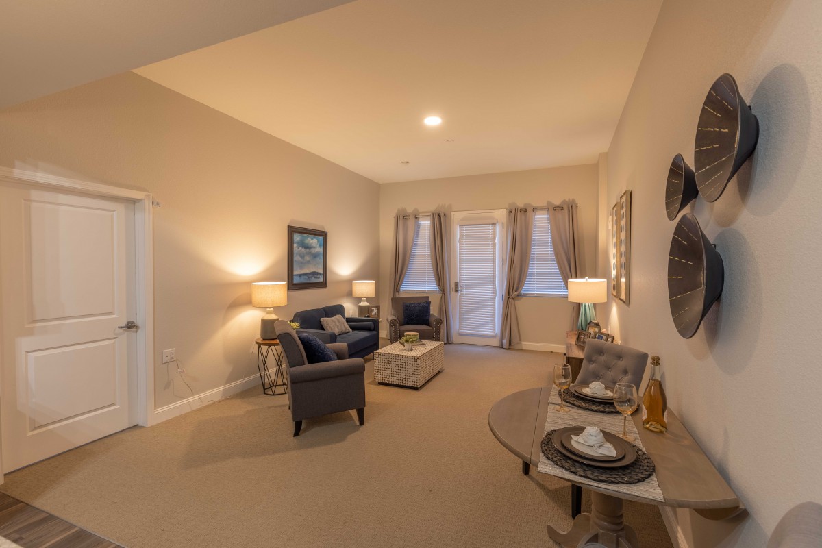 A cozy living room with comfortable seating, ambient lighting, and stylish decor.