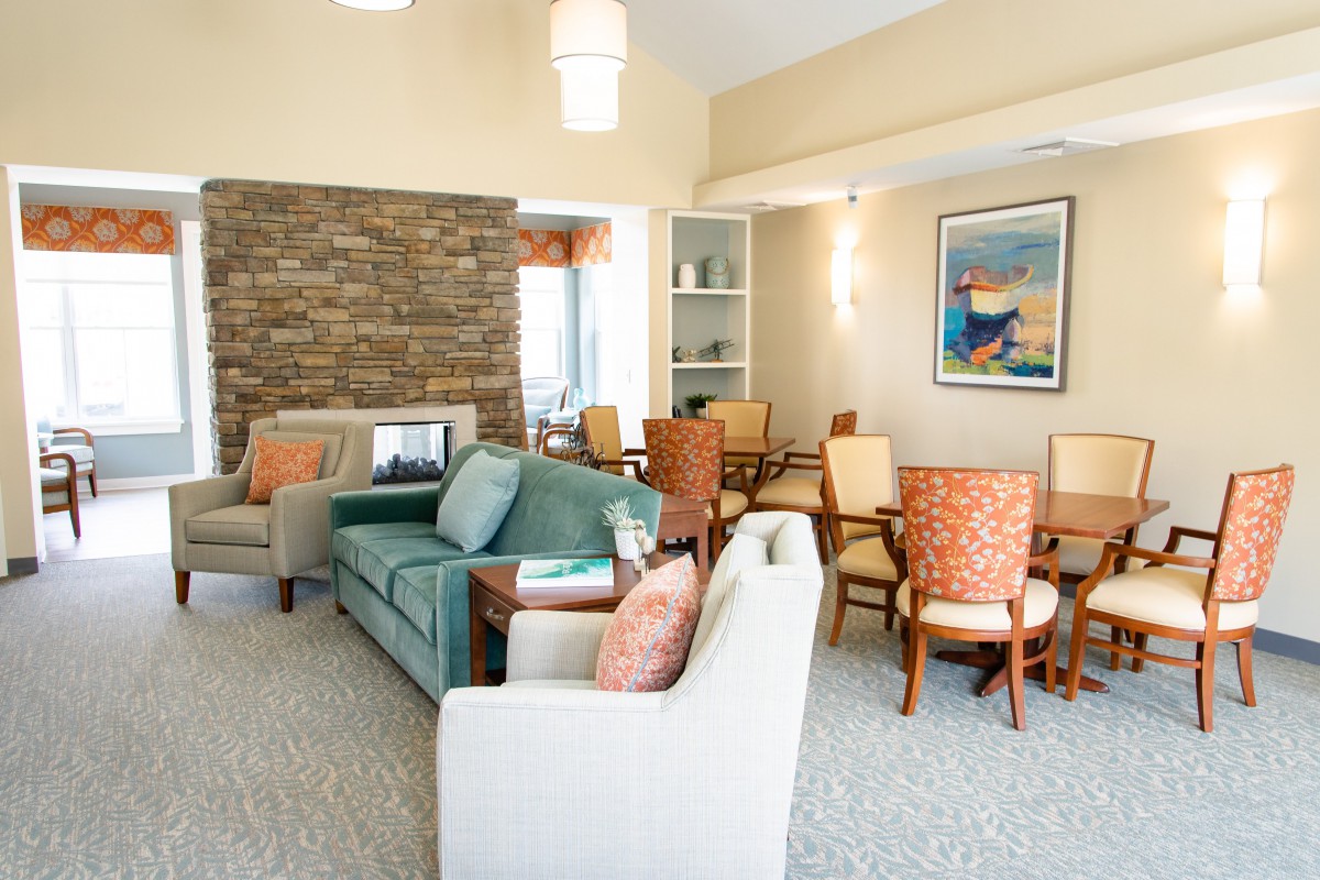 A cozy living room with comfortable seating and a fireplace.
