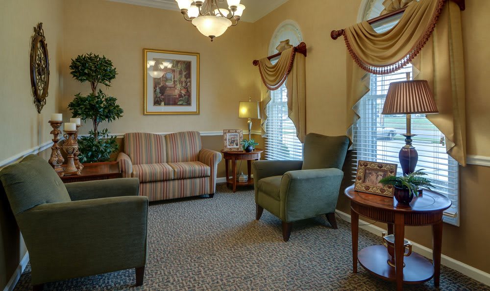 A cozy living room with comfortable seating and elegant decor.