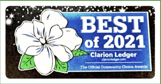Best of 2023 award by Clarion Ledger, featuring a white flower and blue background.