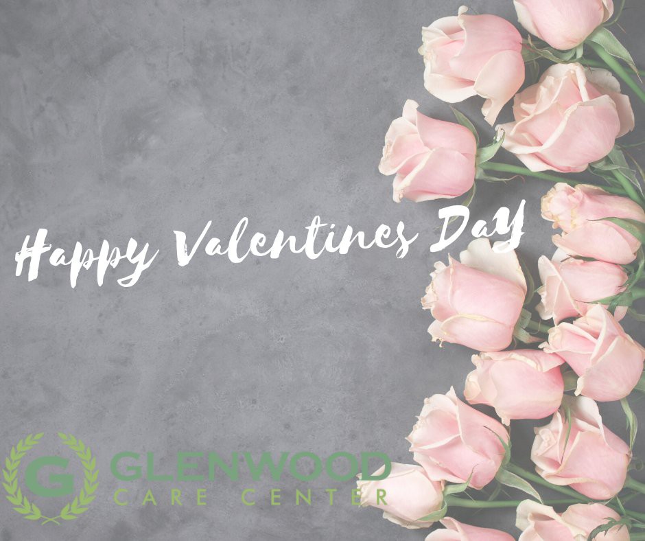 A Valentine's Day greeting card featuring pink roses on a gray background.