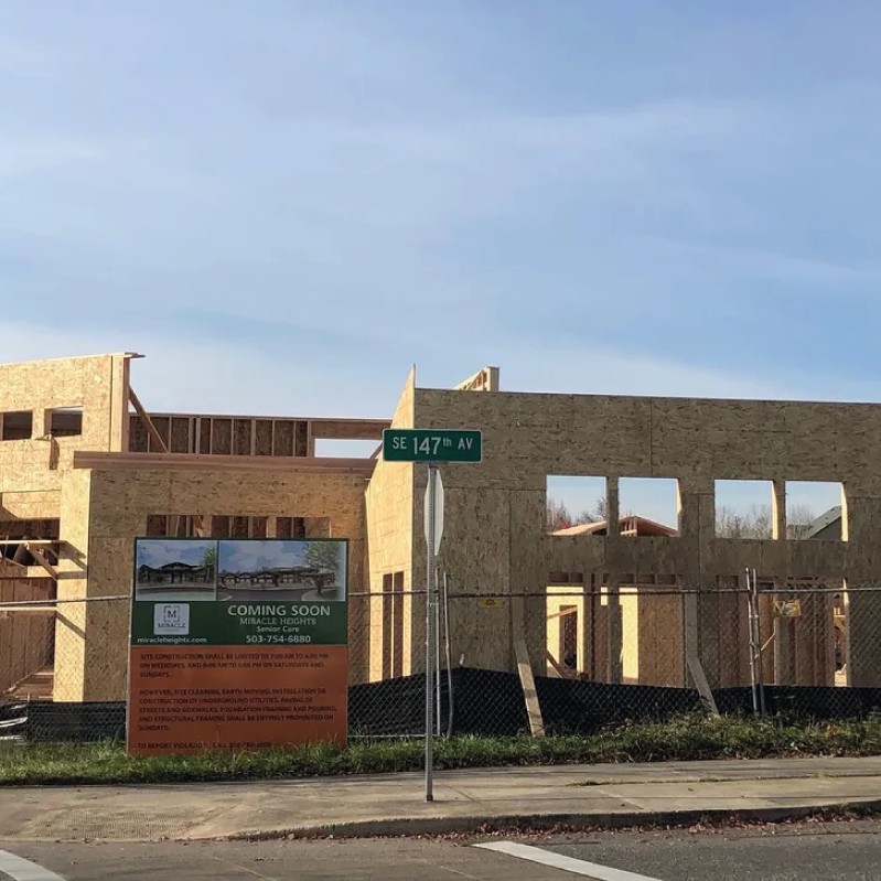 An unfinished building at a construction site during the daytime.