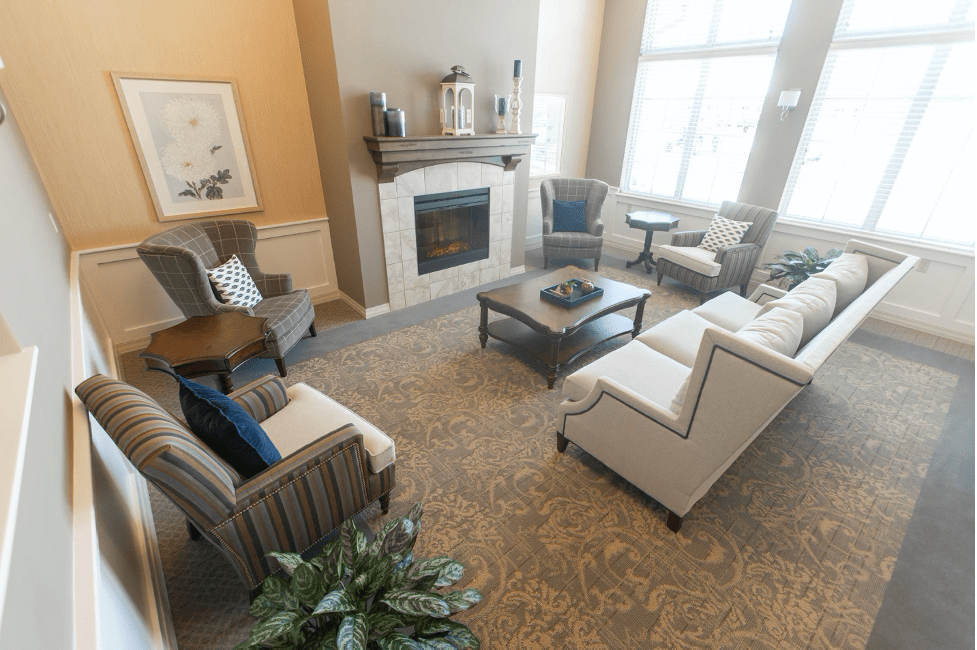 A cozy living room with elegant furniture and a fireplace.