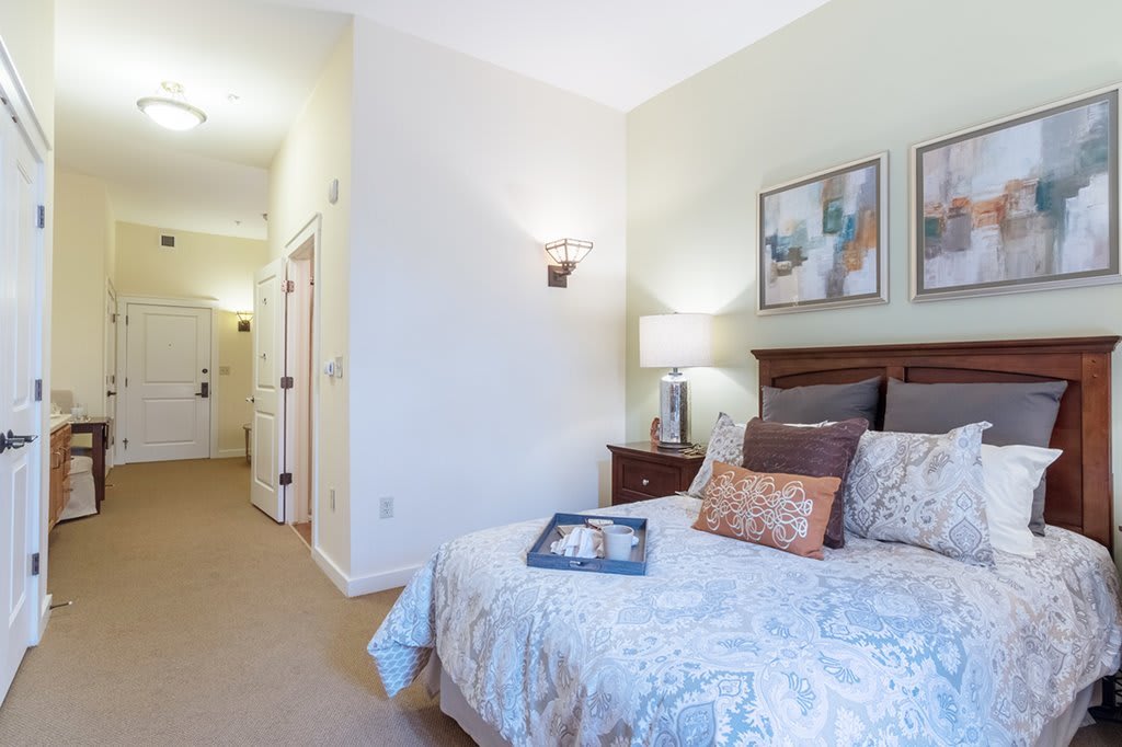 A cozy bedroom with elegant decor and soft lighting.