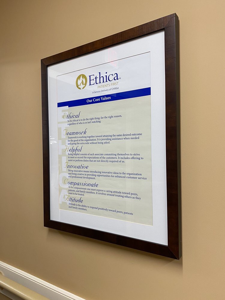 A framed document titled 'Ethica' mounted on a beige wall, displaying guidelines or principles.