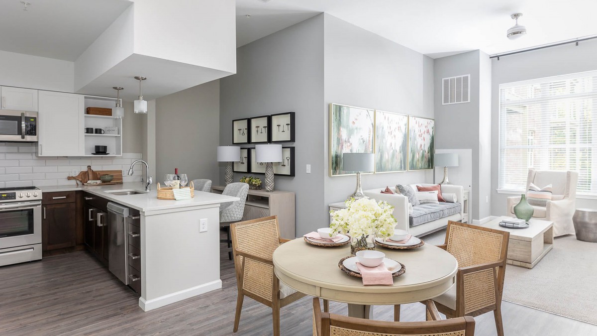 A modern open-concept living and dining area with neutral tones and stylish decor.