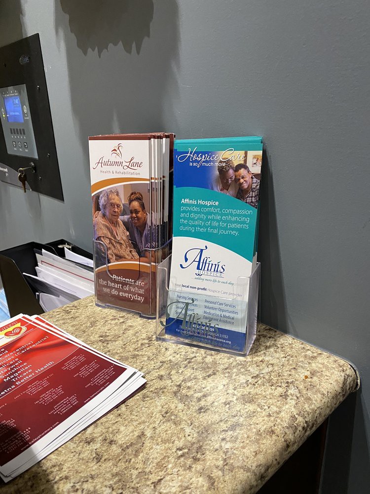Brochures displayed on a counter in an office setting.