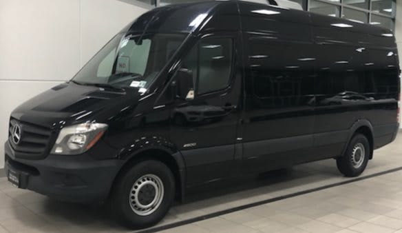 A black van parked indoors.