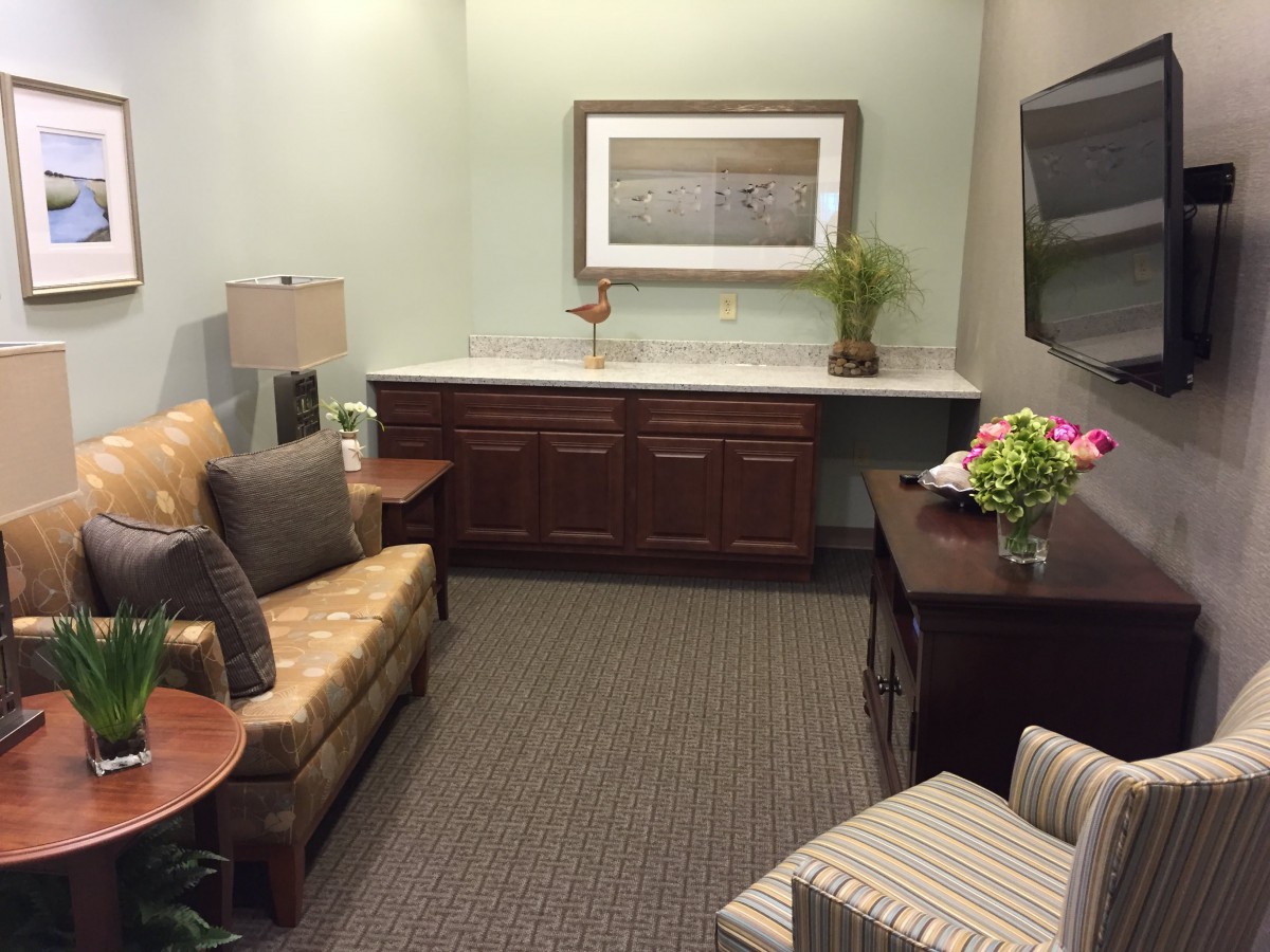 A cozy waiting room with comfortable seating and tasteful decor.