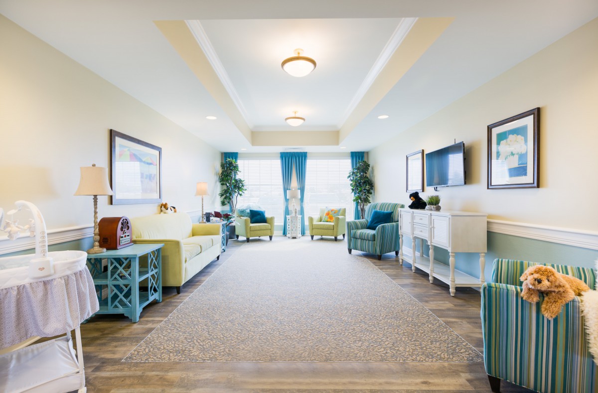 A bright and modern living room with stylish furniture and decorative elements.