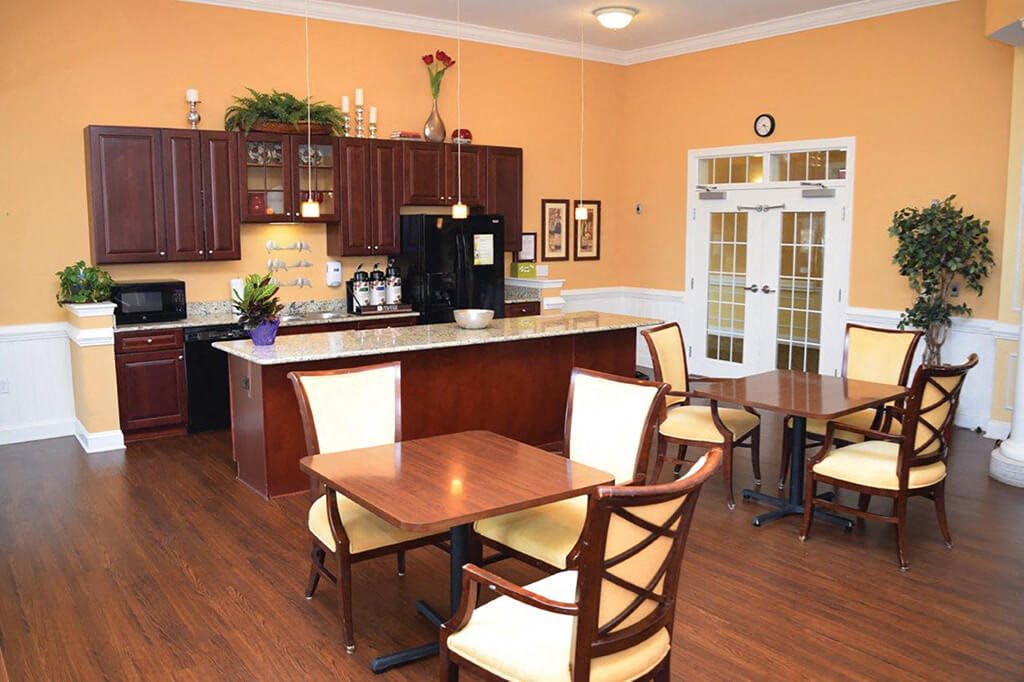 A cozy kitchen and dining area with wooden furniture and warm decor.