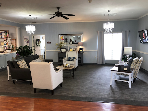 A cozy and well-decorated living room featuring a blend of modern and classic furniture.