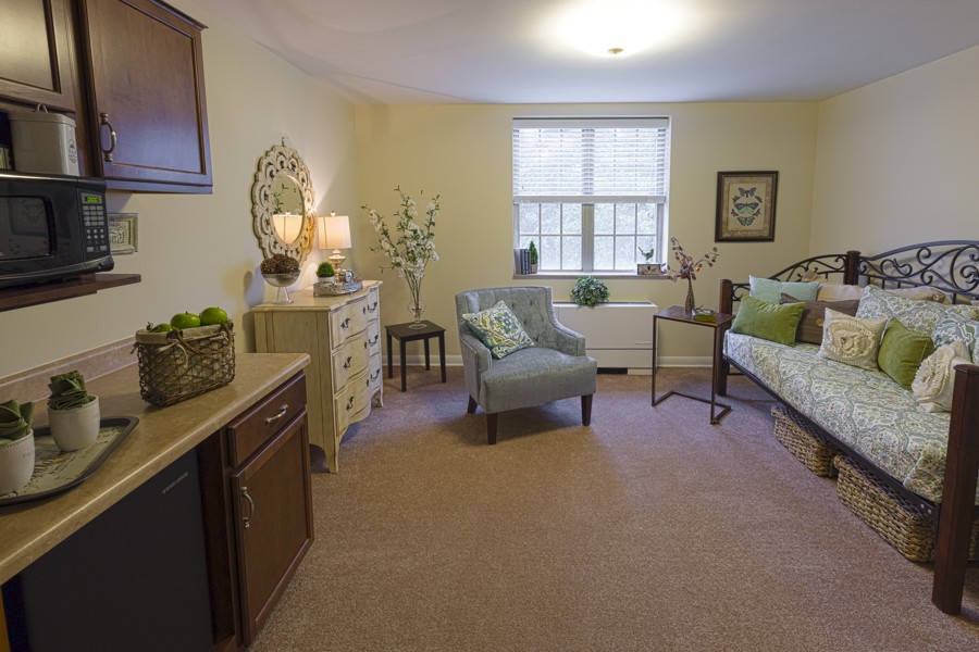 A cozy living room with comfortable seating and elegant decor.