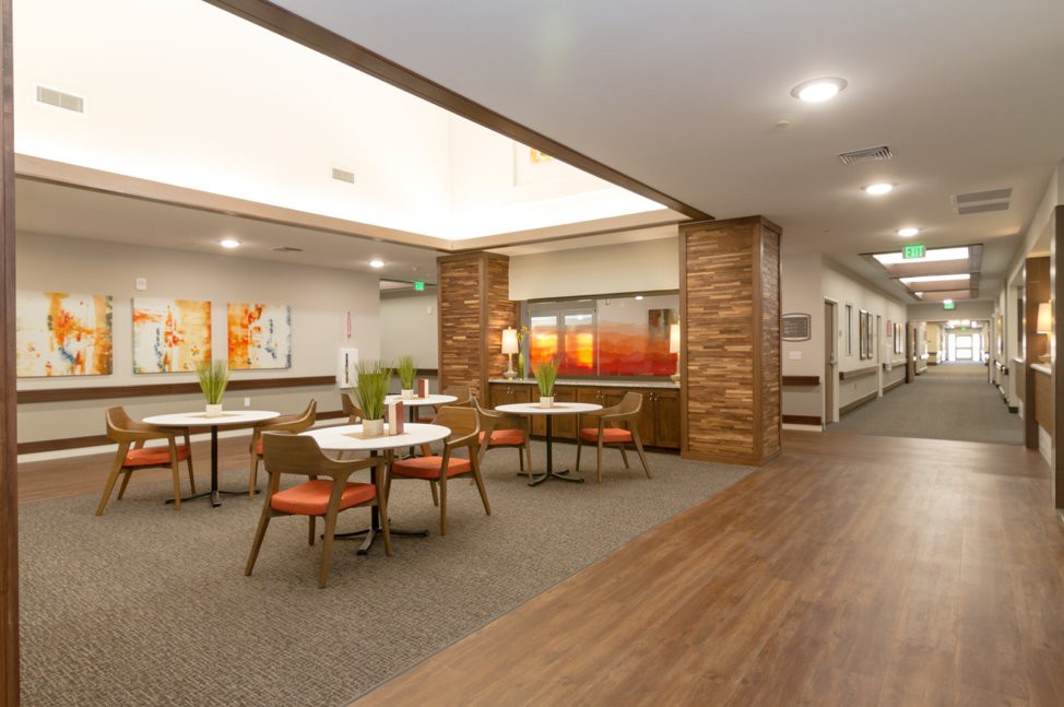 A modern dining area with stylish dcor and neatly arranged tables and chairs.