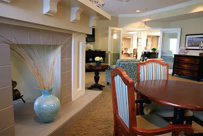 A modern living room and dining area with elegant furniture and decor.